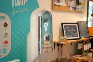 a refrigerator in a store next to a table at Camping Pod's in Hanworth