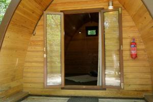 an inside view of a wooden cabin with a fire hydrant at Camping Pod's in Hanworth