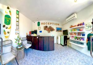 a waiting room of a restaurant with a counter and chairs at Coco Pina in Prachuap Khiri Khan +49 photos