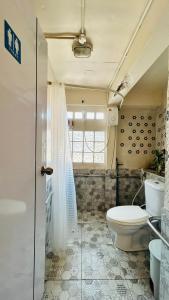 a bathroom with a toilet and a shower at The Dreamcatcher Hostel Nathon SamuiSunset in Nathon +96 photos