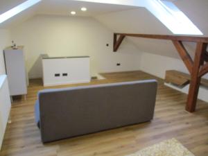 a loft with a couch in the middle of a room at Parsberger Ferienhaus 23 a in Parsberg +9 photos