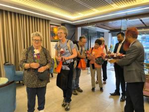 a group of people standing around in a lobby at Sylhet Paradise Inn in Sylhet +162 photos