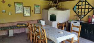 a kitchen with a table and chairs in a kitchen at Valchid Guest House in Valchid +26 photos