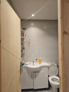a bathroom with a white sink and a toilet at Rabat Luxury in Salé