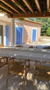 a table with two wine glasses on top of it at Maison Tropez in Cogolin +16 photos