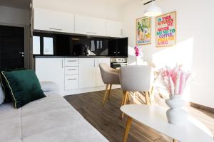 a living room with a couch and a table at Marojica Apartments 2 in Cavtat