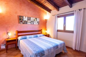 a bedroom with a bed and a window at Casa Ailen in Islas Baleares +25 photos