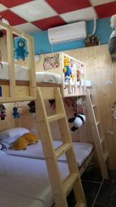 Postel nebo postele na pokoji v ubytování Checheng Backpackers Hostel