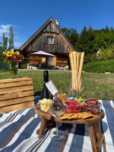 a picnic blanket with a table with food on it at Living & Relax Resorts in Sausal