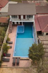 an overhead view of a swimming pool in a house at Eden De Vangvieng in Vang Vieng