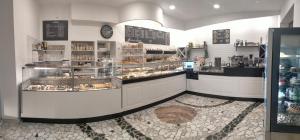 a bakery with a counter with cakes and pastries at Al Barone 37 in Foggia