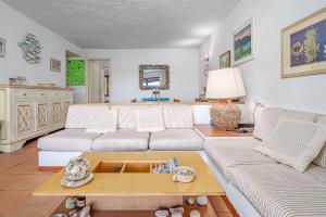 a living room with two couches and a coffee table at Marana Orizzonte in Santa Marinella