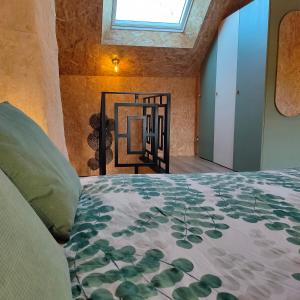 a bedroom with a bed and a window at B&B suite de charme in Guipry-Messac