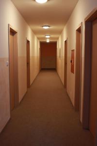 an empty hallway in an office building at Horská bouda Aldrov in Vítkovice