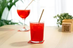 a red drink in a glass sitting on a table at Muthu La Perla Tenerife in Puerto de la Cruz +21 photos