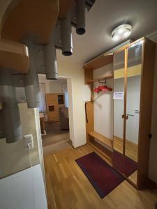 a room with a hallway with a door and a room with a room at fewo-brigitte in Buxtehude