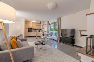 a living room with a couch and a table at Copper Suite · Seebach in Zurich