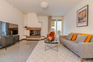a living room with a couch and a tv at Copper Suite · Seebach in Zurich