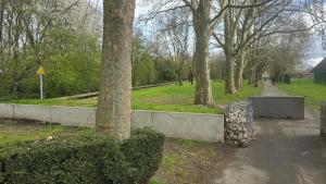 a park with trees and a sidewalk and a path at Appartement proche Lille in Mons-en-Baroeul +10 photos