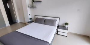 a large white bed in a white room at Modern Studio apartment Armonia Court in Paralimni +22 photos