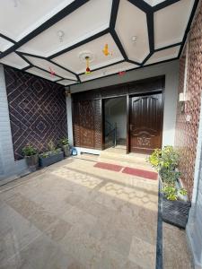 a front door of a building with a ceiling at MadCrew GuestHouse in Islamabad +16 photos