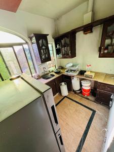 a kitchen with a sink and a counter top at MadCrew GuestHouse in Islamabad