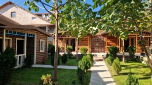 a house with a yard in front of it at Paulownia Garden in Mtskheta