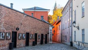 an alley in a city with brick buildings at Original Sokos Hotel Kupittaa in Turku