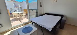a small hospital room with a bed and a balcony at A & G Casares Costa in San Luis de Sabinillas +21 photos