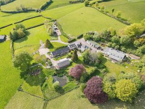 an aerial view of a house in a field at Dunkery Cottage Wheddon Cross in Wheddon Cross