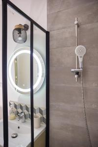 a bathroom with a shower and a mirror at EMMA - Centre Historique - Parking privée - CLIM in Auch