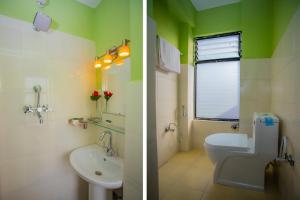 two pictures of a bathroom with a sink and a toilet at Hotel Sambridhi in Panepa +11 photos