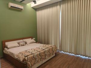 a bedroom with a large bed and a window at The Riverside Nook Calicut in Kozhikode