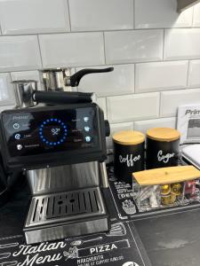 a coffee maker sitting on top of a kitchen counter at Με θέα το Κάστρο Apartment in Nafpaktos
