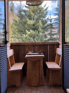 a bathroom with a sink and two benches at Apartament Rodzinny Deluxe in Poronin +3 photos