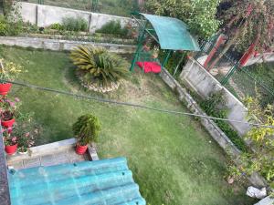 an aerial view of a garden with an umbrella at Nagdaha homestay in Pātan