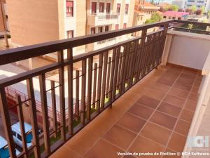 a balcony with a black railing and a tile floor at Duque de Ahumada 8 in Soria