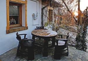 a table and chairs sitting next to a building at FOLK in Old Town in Kecskemét