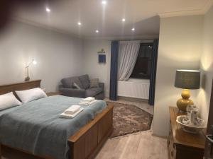 a bedroom with a bed with two towels on it at Hrochoťský mlyn in Hrochoť +15 photos