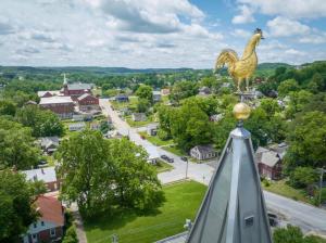 a statue of a chicken on top of a building at Germantown Inn & Lounge in Hermann