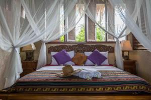 Tempat tidur dalam kamar di Kainalu Beach House