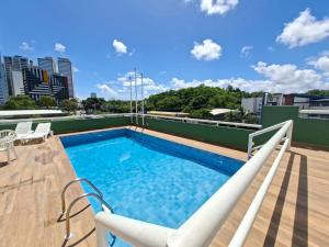 a swimming pool on the roof of a building at Rede Andrade Bahia in Salvador