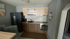a kitchen with a sink and a refrigerator at Modern Stay Provadia in Provadiya