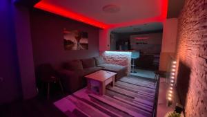 a living room with a couch and red lighting at Modern Stay Provadia in Provadiya