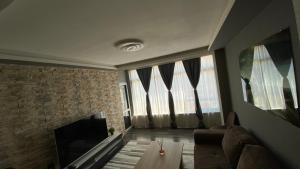 a living room with a fireplace and a couch at Modern Stay Provadia in Provadiya