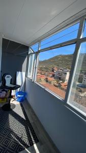 an empty room with a table and a window at Modern Stay Provadia in Provadiya