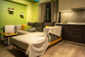 a living room with a couch and a table at Tsitsipas Apartment in Alexandroupoli