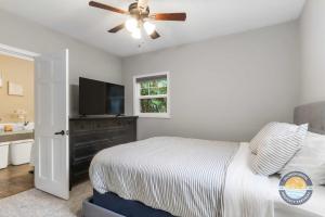 a bedroom with a bed and a ceiling fan at Charming Pet-Friendly Lake Retreat in Lake Geneva