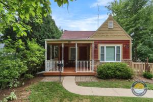 a small house with a porch and a driveway at Charming Pet-Friendly Lake Retreat in Lake Geneva