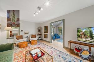 a living room with a couch and a tv at Lake Geneva Escape 4BR Arcade Fire Pit and Deck in Lake Geneva